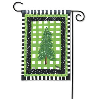 Snowy Pines garden flag with evergreen tree on green plaid background, black polka dot and stripe border