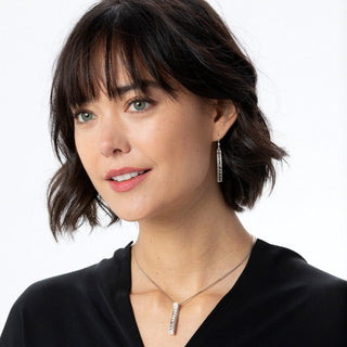 Woman wearing silver Brighton Spectrum French Wire Earrings with matching necklace