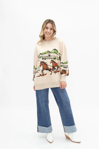 Cream oversized sweatshirt with western running horses and mountain desert graphic print