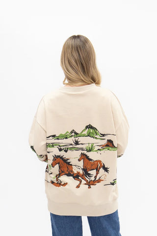 Cream oversized sweatshirt with Western running horses and desert landscape back graphic