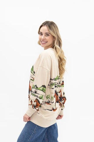 Cream sweatshirt with Western horse and landscape print, shown from back side angle