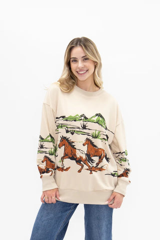 Oversized cream sweatshirt with running horses western landscape graphic print