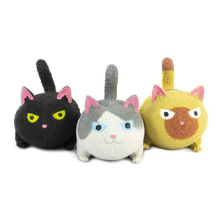 Three plush toys shaped like cats