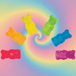 Colorful gummy bear pencil toppers on rainbow spiral background