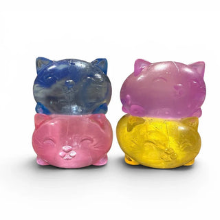 assorted jelly cat squishy toys in blue pink purple and yellow with glitter and marbled swirls