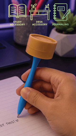 Blue ballpoint pen with tan squishy dumpling topper held over lined notebook