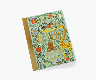 Rifle Paper Co. Storybook Baby Card with mint green illustrated cover featuring giraffe, teddy bear, and gold text