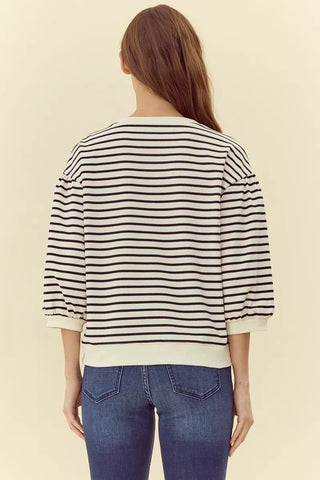 White and black striped 3/4 puff sleeve sweatshirt top, back view