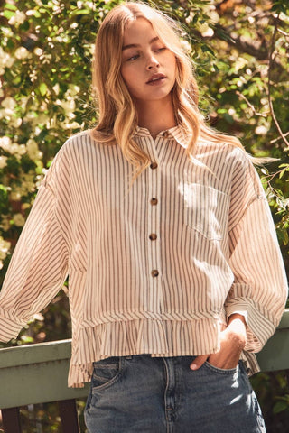 Oddi cream striped long sleeve button-up shirt with ruffle hem and chest pocket
