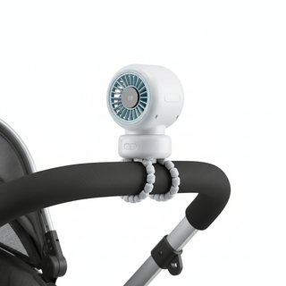 Close-up of stroller fan clipped onto a stroller bar showing the clip attachment mechanism