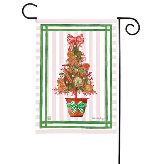 Studio M holiday garden flag featuring a decorated gingerbread Christmas tree on pink striped background