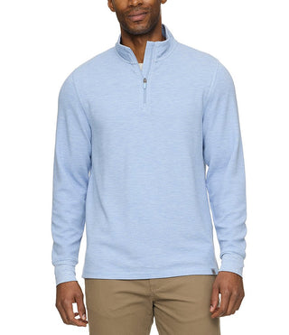 Man wearing Flag and Anthem light blue quarter-zip waffle knit mock neck pullover with khaki pants