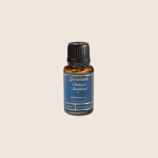Aromatique Sunkissed Sandalwood Refresher Oil in 0.5 fl oz amber glass bottle with blue label