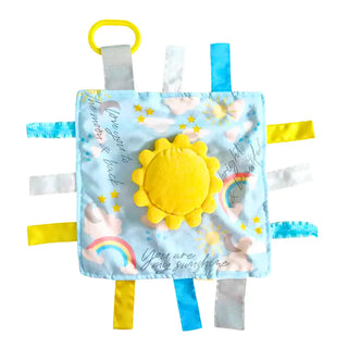 White background product shot of square Sunshine Lovey with D-ring clip