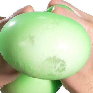 Hands stretching a green Super Nee Doh stress ball showing its flexibility