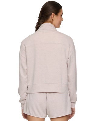Women's light pink heathered quarter-zip sweatshirt with matching shorts, back view.
