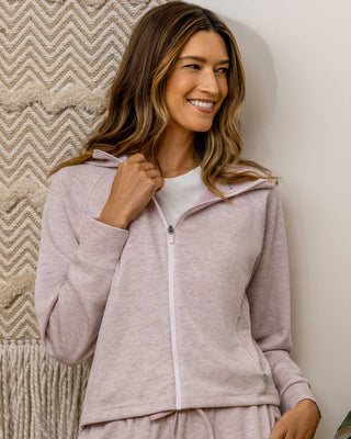 Woman smiling wearing Flag and Anthem Super Soft Full Zip Hoodie in pink heather colorway