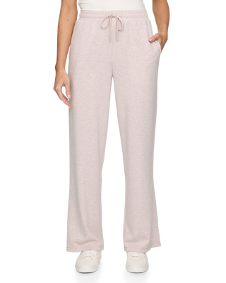 Woman wearing light pink heather wide leg drawstring sweatpants with side pockets and white sneakers
