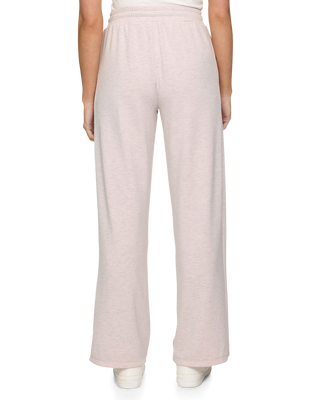 Back view of Super Soft Wide Leg Pants in pink heather with elastic waistband on female model.