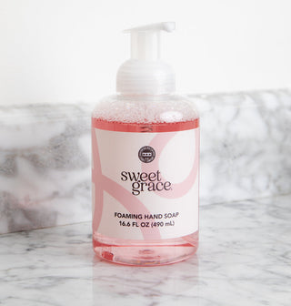 Sweet Grace foaming hand soap 16.6 fl oz bottle by Bridgewater Candle Company on marble surface