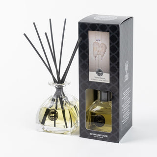Bridgewater Sweet Grace reed diffuser with black reeds beside dark decorative packaging box