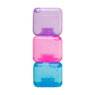 Three stacked colorful ice cube-shaped toys in purple, pink, and blue colors
