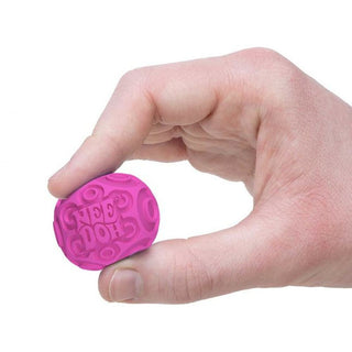 Hand holding a pink stress ball with text 
