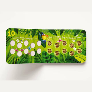 Ten Little Monkeys board book open spread showing page with 10 monkeys, tree frog, and tactile die-cut holes for counting