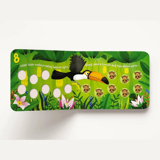 Ten Little Monkeys children's book page featuring 8 monkeys, toucan, bananas, and interactive counting holes on matte board