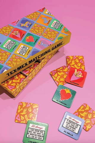 El Arroyo Tex-Mex Matching Game box with colorful lotería-style cards spread on pink background