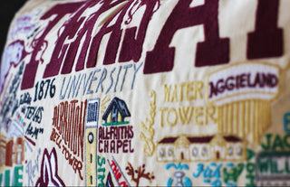 Catstudio Texas A&M University embroidered pillow featuring campus landmarks in maroon and cream