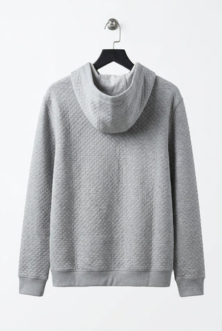 Gray quilted hoodie back view with diamond texture pattern and ribbed cuffs