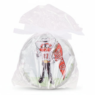 Toy figure with a surfboard in a clear plastic bag 