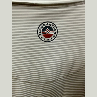 Flag & Anthem Texas Tech polo chest detail with micro-feeder stripes and embroidered logo