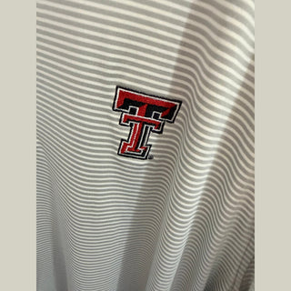 Red black embroidered Texas Tech T logo detail on heathered striped polo fabric