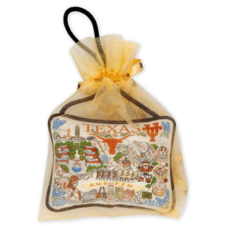 University of Texas Austin ornament by Catstudio displayed in gold organza gift bag