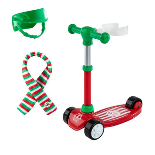 Elf on the Shelf Stand-N-Scoot toy set with red scooter, green helmet, and striped scarf accessories