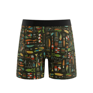 Shinesty Reel Nice Ball Hammock boxer briefs with colorful fishing lures on dark background