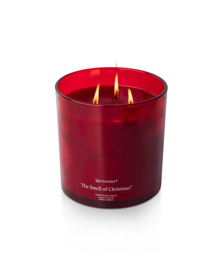 Aromatique The Smell of Christmas red glass three-wick 48oz candle, lit flames