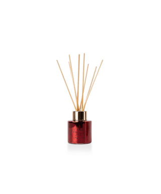 Aromatique The Smell Of Christmas Mini Reed Diffuser in red mercury glass with gold collar and natural reed sticks