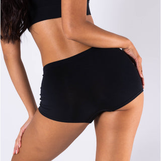 Back view of black modal boyshort underwear with wide waistband on female model