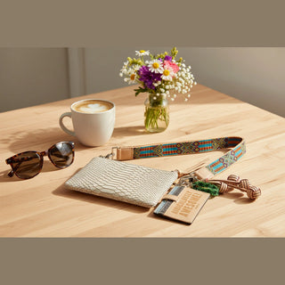 Beige textured pouch with colorful strap and keychain 