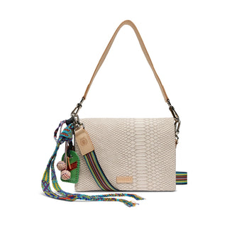 Beige handbag with a colorful strap and keychain