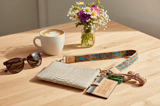 Beige textured pouch with colorful strap and keychain 