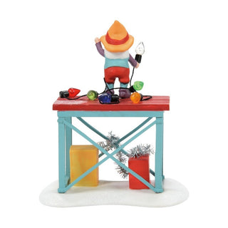 Department 56 Time to Decorate figurine showing elf decorating table with colorful ornaments