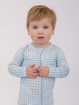 Child wearing the gingham and cottage blue zippie