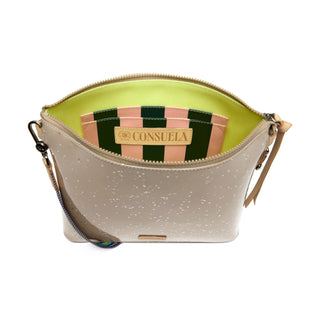 Beige handbag with a striped lining and visible brand name 