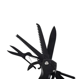 Open black 12-function multi-tool showing serrated saw, knife blade, scissors, and bottle opener layout