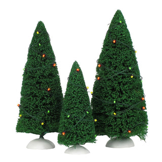 Department 56 set of three green lit Christmas trees with multicolor twinkling lights on white bases