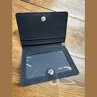 Open navy leather ID wallet showing clear plastic card window and silver snap closures